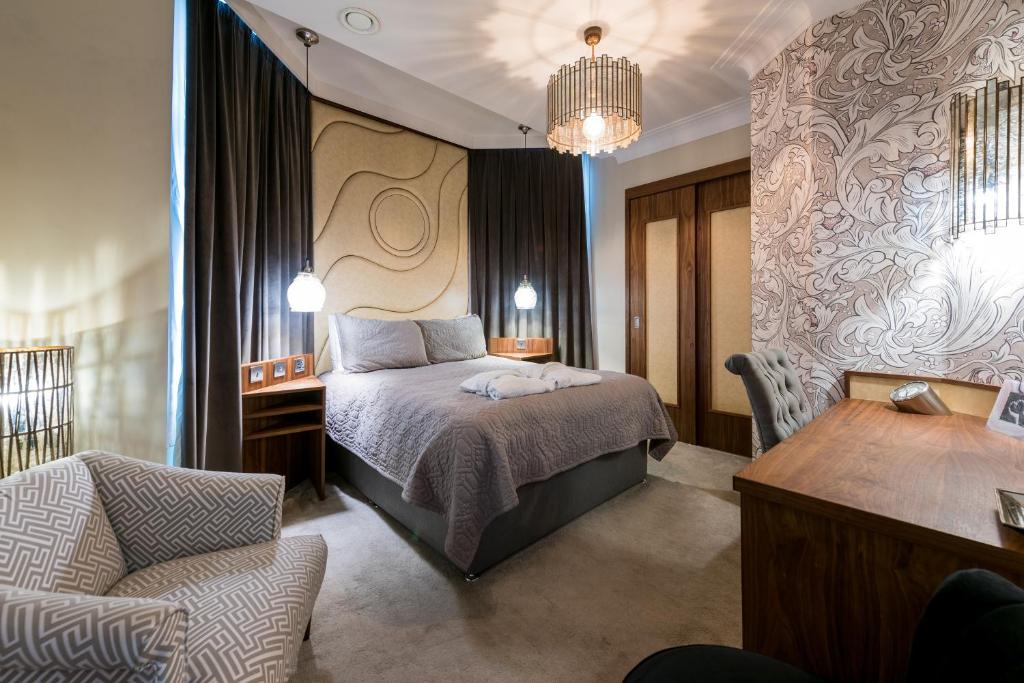 Postel nebo postele na pokoji v ubytování Prom Hotel