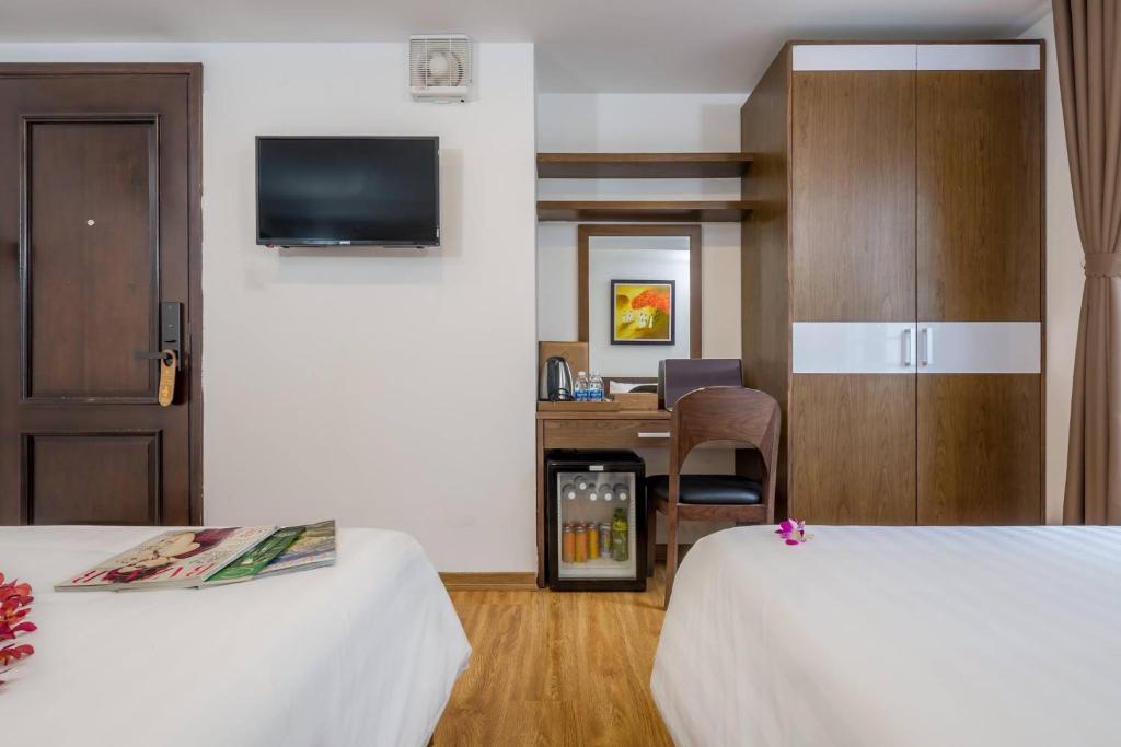 Postel nebo postele na pokoji v ubytování Silana Beachfront Hotel & Spa