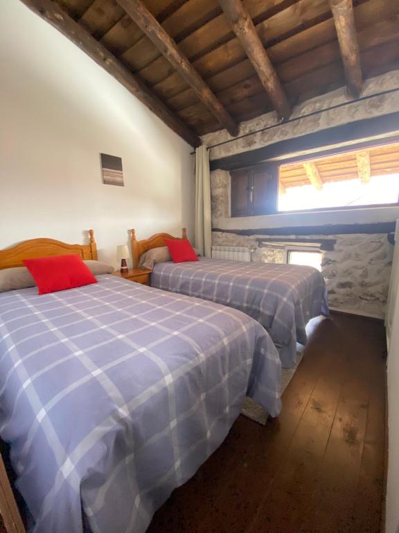 A bed or beds in a room at Adrados Mar de Pinos