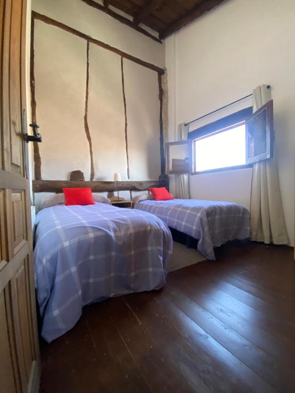 A bed or beds in a room at Adrados Mar de Pinos
