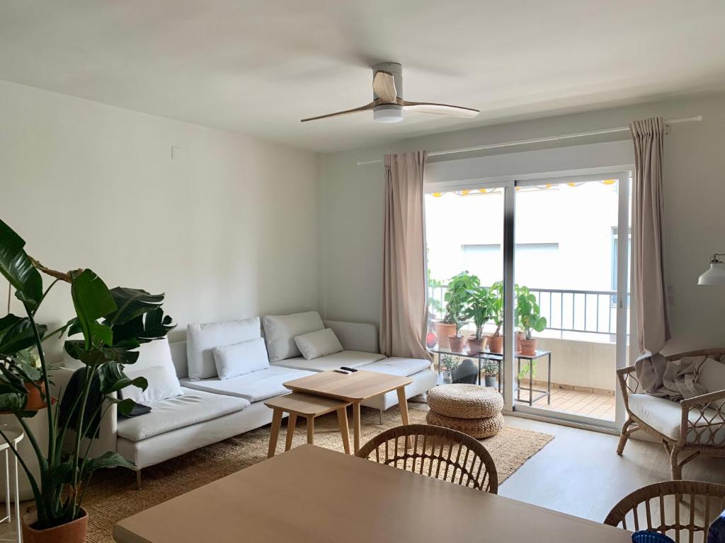 a living room with a couch and a table at Cosy apartment in Almuñecar in Almuñécar