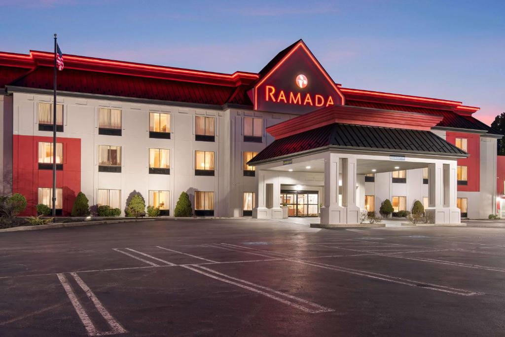 a parking lot in front of a hotel at Ramada by Wyndham Harrisburg/Hershey Area in Harrisburg