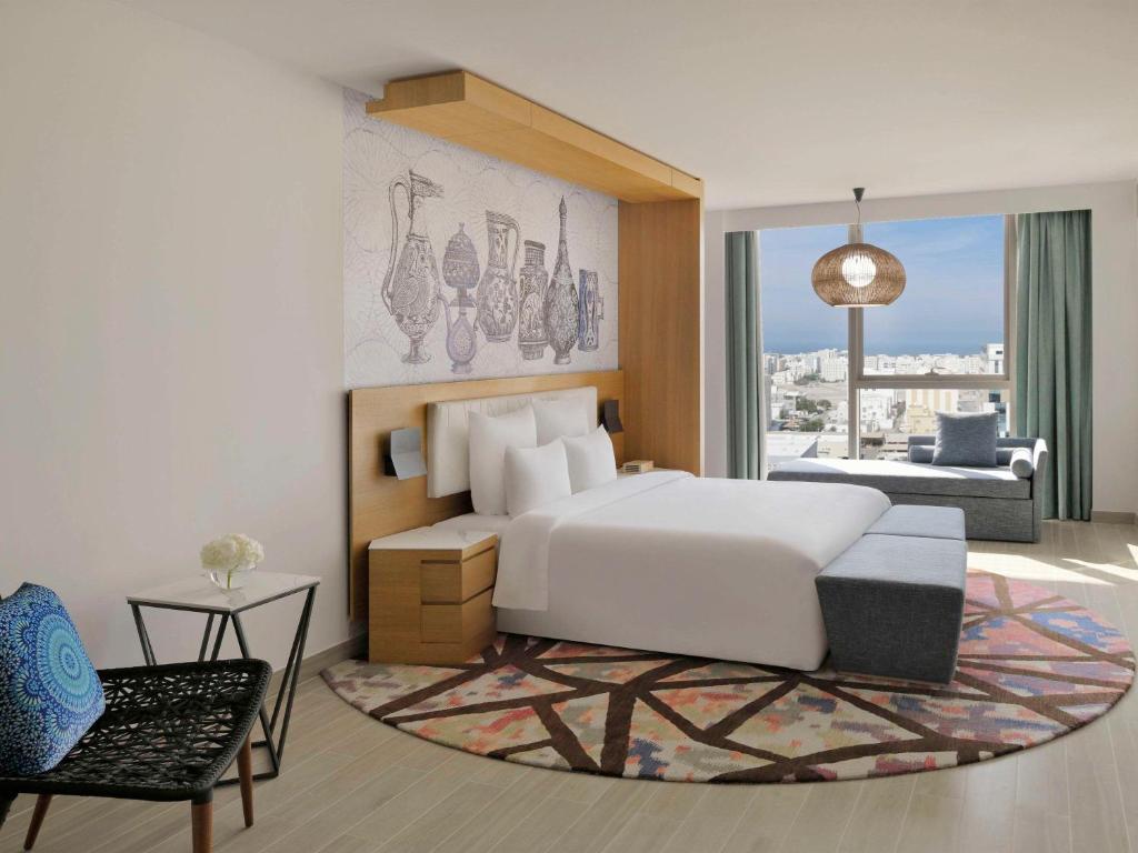 Postel nebo postele na pokoji v ubytování Mövenpick Hotel & Apartments Ghala Muscat