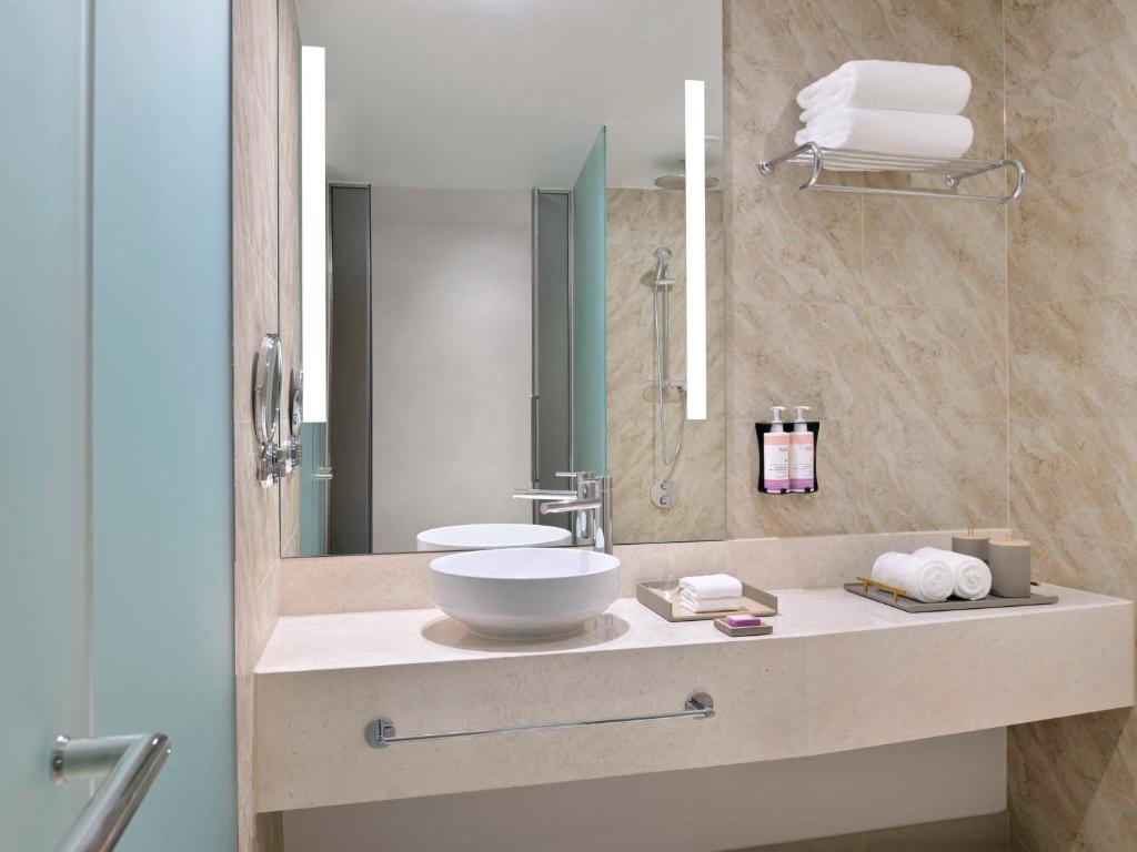 Koupelna v ubytování Mövenpick Hotel & Apartments Ghala Muscat