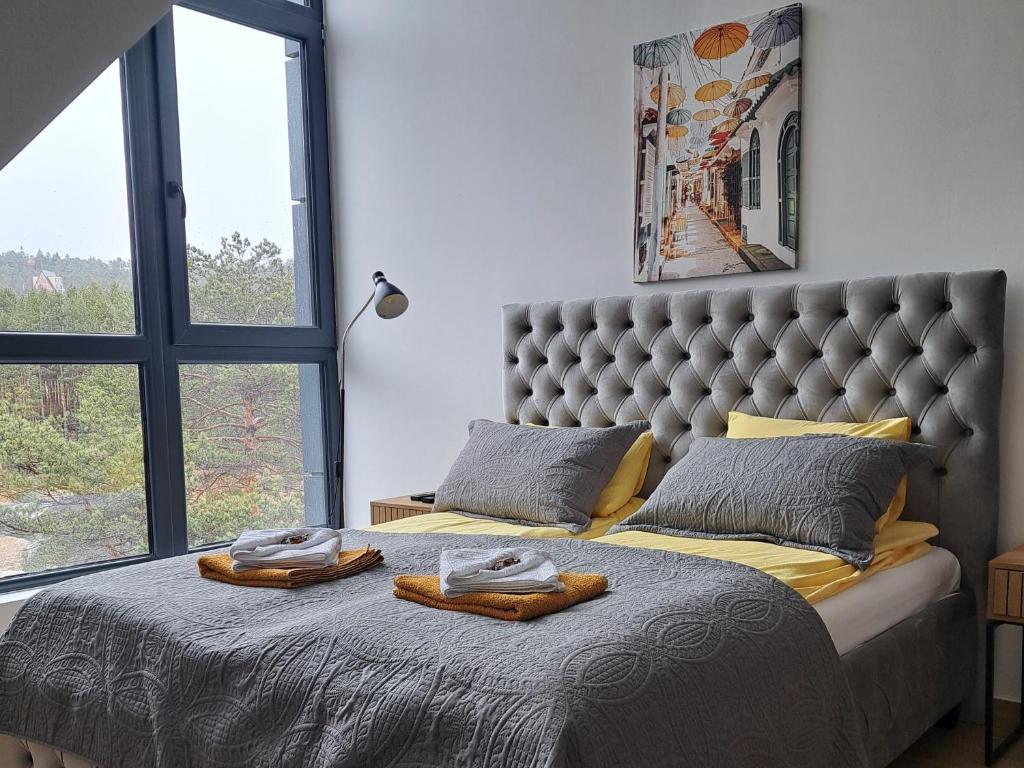 Uma cama ou camas num quarto em Apartman Yellow Moon