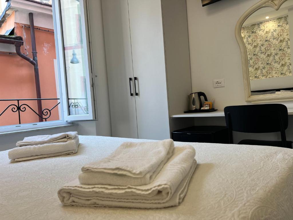 Postel nebo postele na pokoji v ubytování Affittacamere Sull'Arco