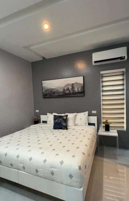 Postel nebo postele na pokoji v ubytování Anavada Suites - Davao City