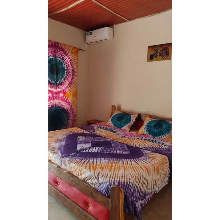 Postel nebo postele na pokoji v ubytování Your Gambian House