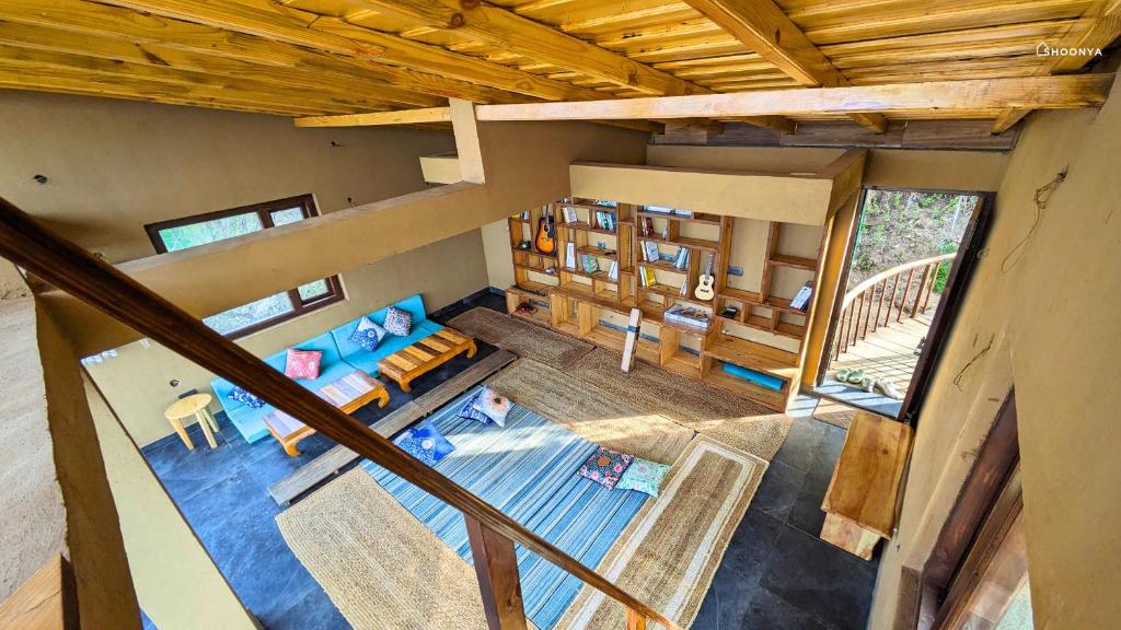 an overhead view of a living room in a house at Shoonya Mukteshwar in Mukteswar
