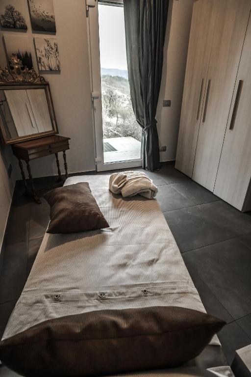 Postel nebo postele na pokoji v ubytování Monte Moro Gavi B&B