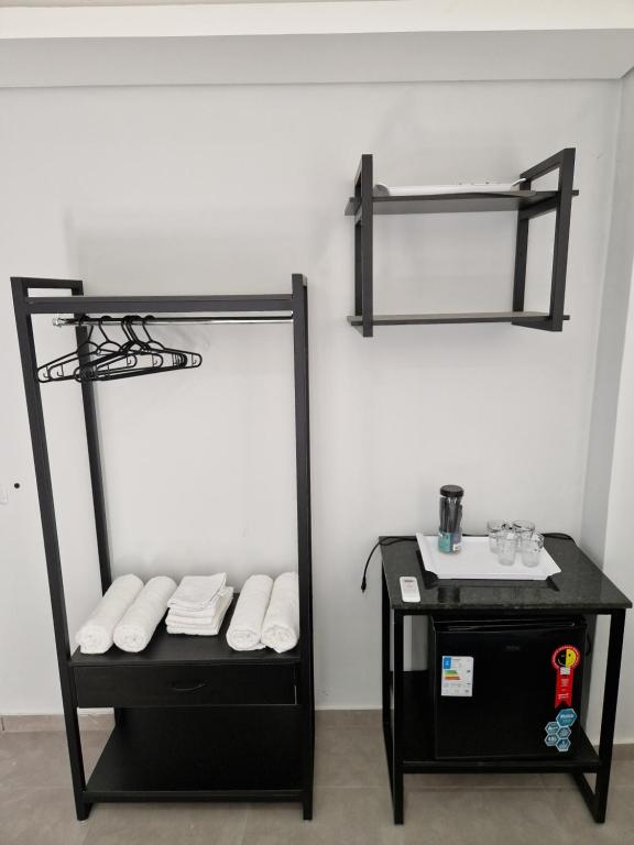 Postel nebo postele na pokoji v ubytování Condomínio Inn Studio