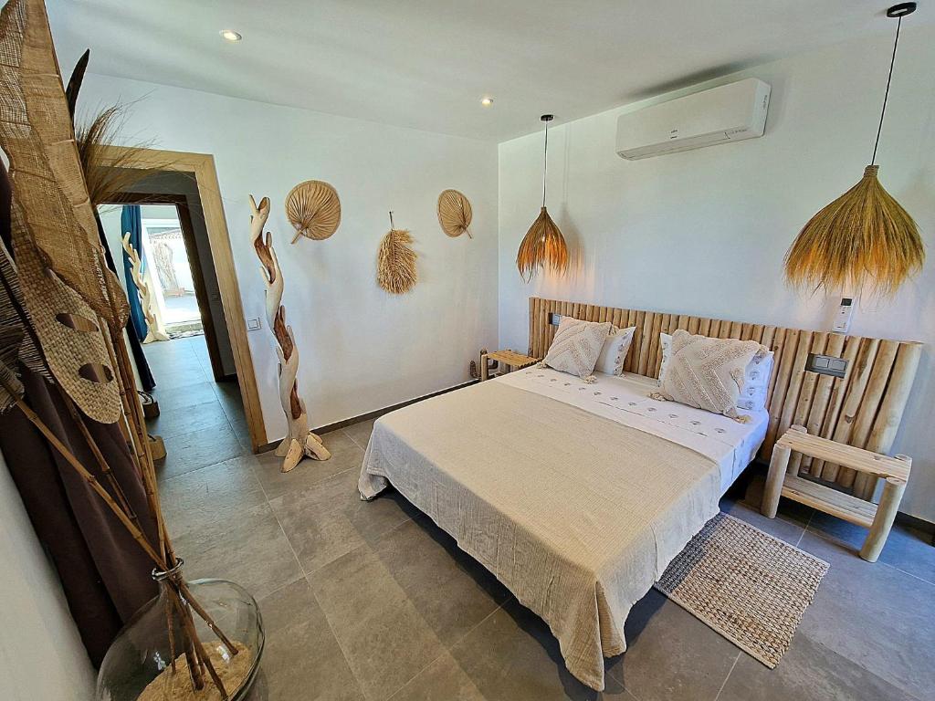 a bedroom with a bed in a room at Villa Lomy Casares in Casares
