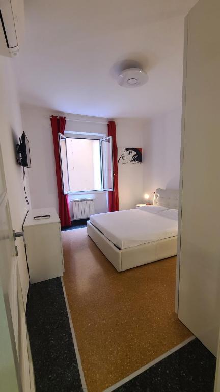A bed or beds in a room at Varazzesuite apartment