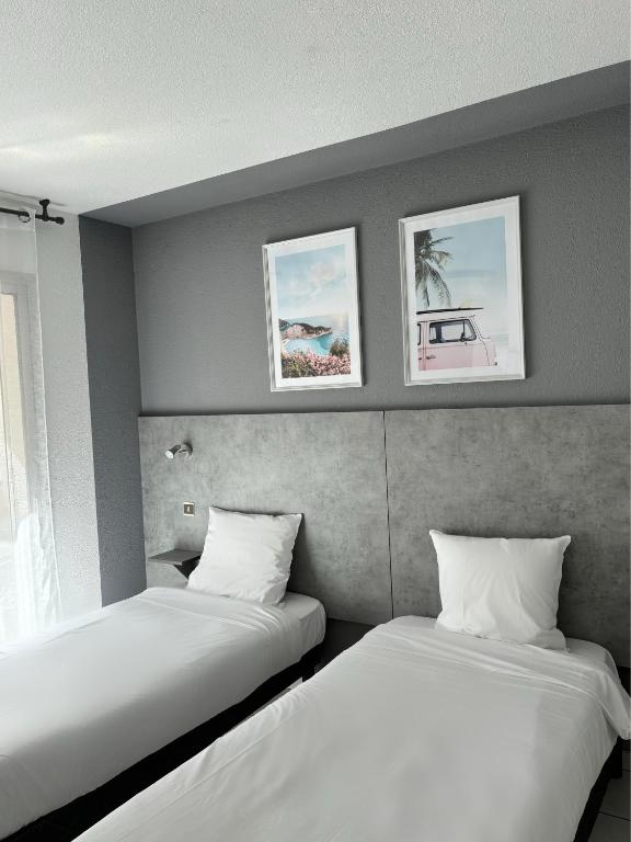 Postel nebo postele na pokoji v ubytování Acapella Hotel