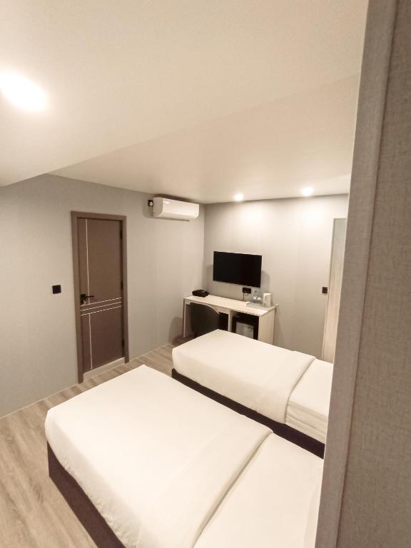 Postel nebo postele na pokoji v ubytování Starry Beach Inn