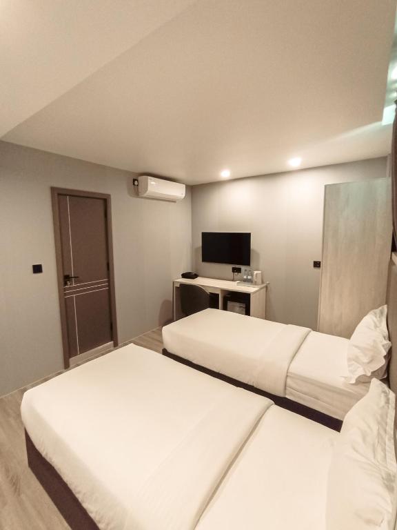 Postel nebo postele na pokoji v ubytování Starry Beach Inn