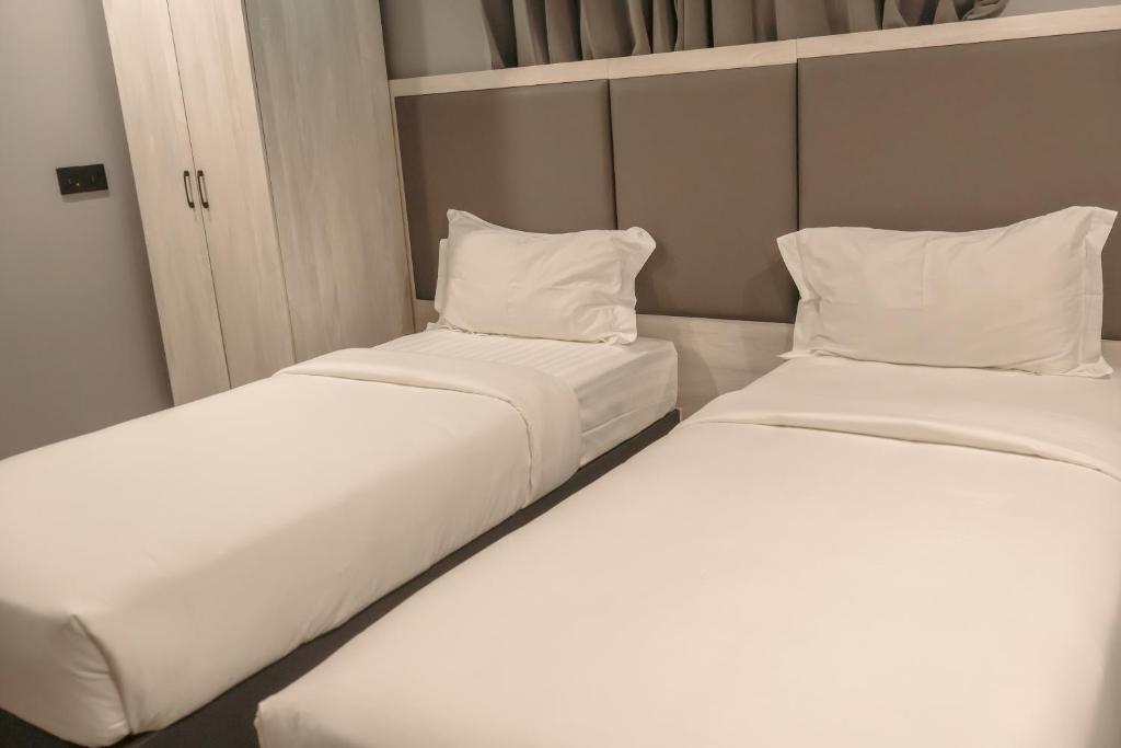 Postel nebo postele na pokoji v ubytování Starry Beach Inn