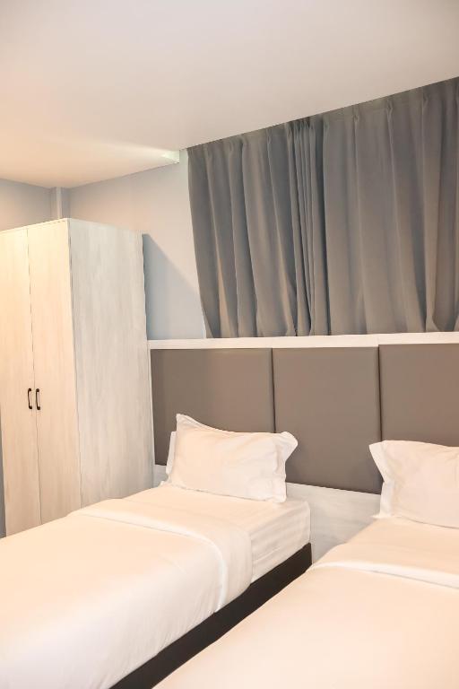 Postel nebo postele na pokoji v ubytování Starry Beach Inn