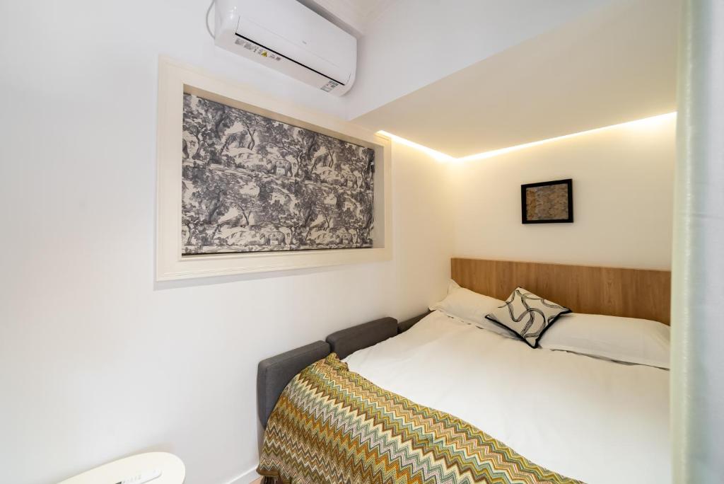 Postel nebo postele na pokoji v ubytování Shanghai Downtown Yi Du B&B - Near Jing'an Temple Subway 200 meters and shopping mall