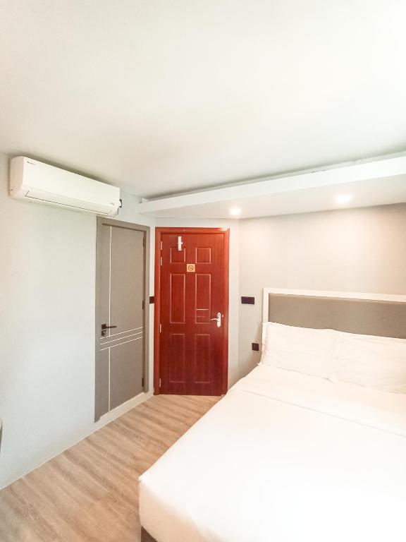 Postel nebo postele na pokoji v ubytování Starry Beach Inn