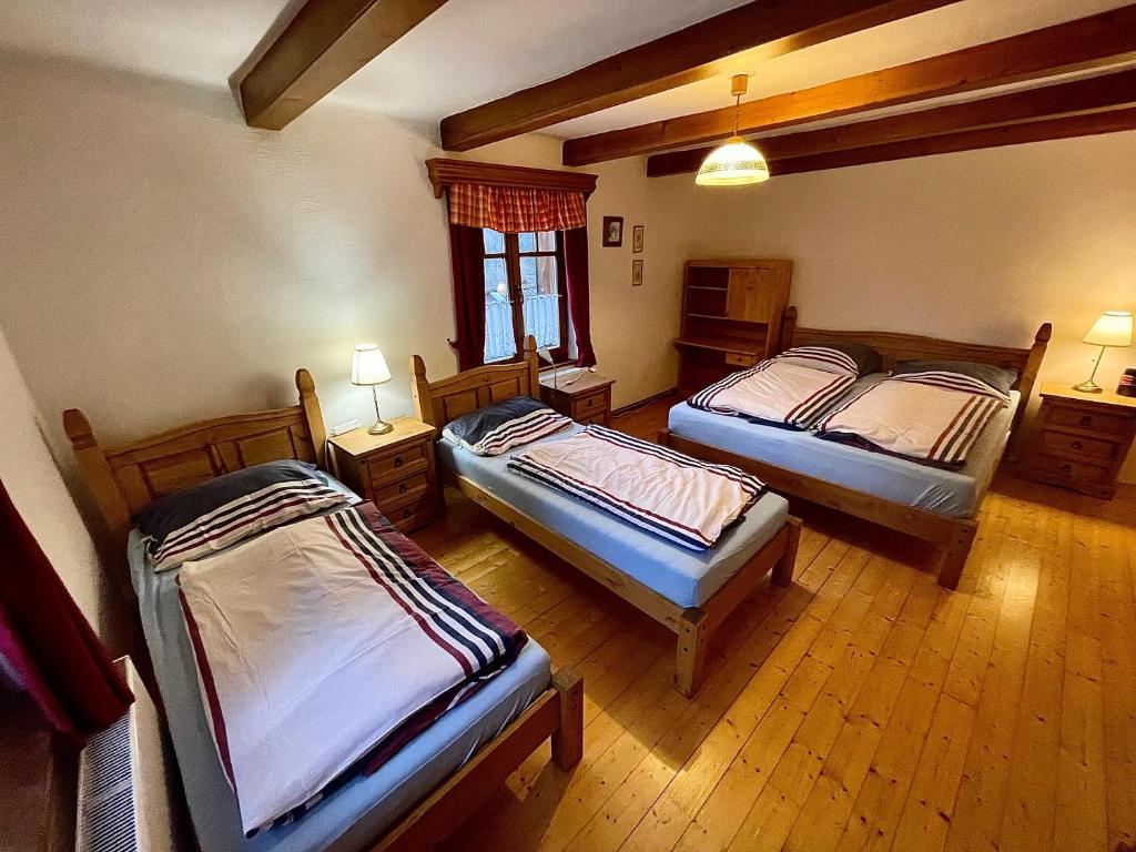 Postel nebo postele na pokoji v ubytování Apartmány Chalupinka