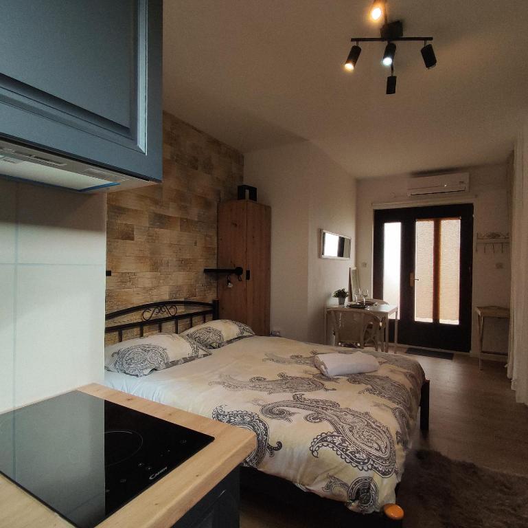 a bedroom with a large bed in a room at Studio apartment with sea view in Sali