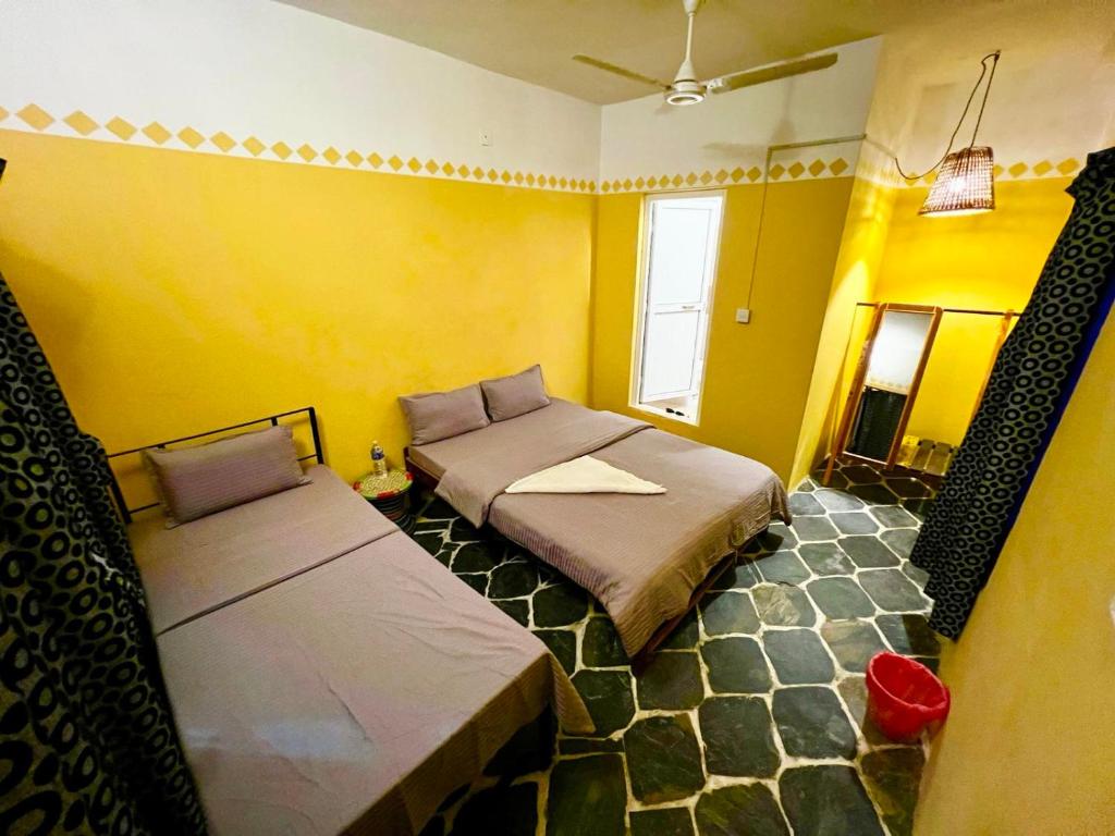 Postel nebo postele na pokoji v ubytování Paris Guest House