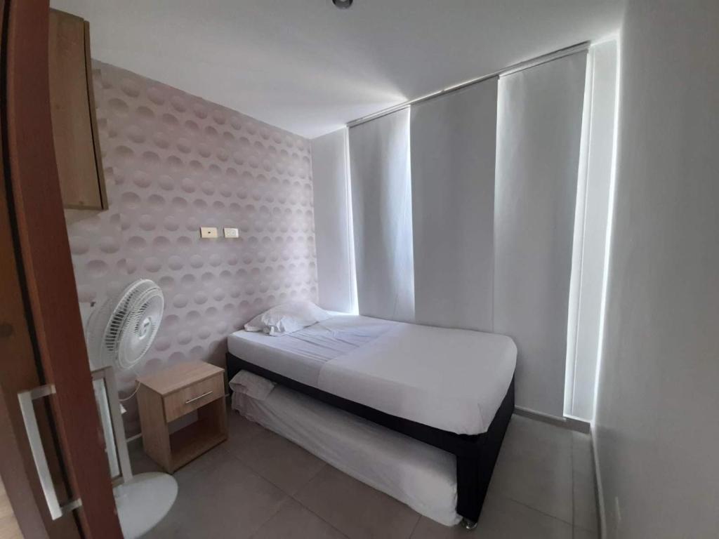 Postel nebo postele na pokoji v ubytování Gaira Apartamento Amoblado Bucaramanga
