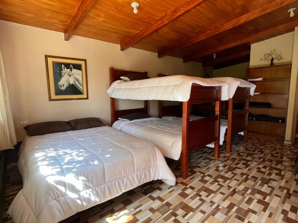 Postel nebo postele na pokoji v ubytování Casa Elalu