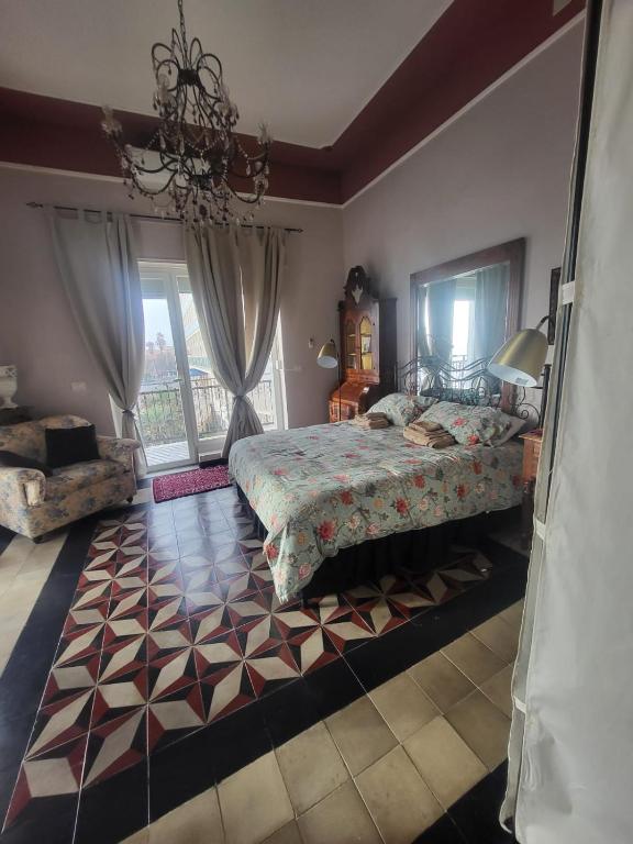 Łóżko lub łóżka w pokoju w obiekcie Romantic House spettacolare vista mare unica nel suo genere