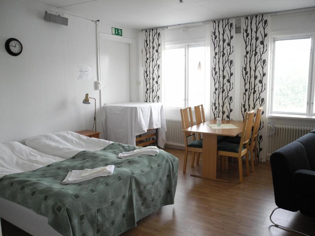 Postel nebo postele na pokoji v ubytování Målilla Hotell & Restaurang