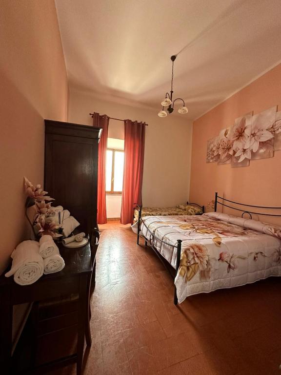 Postel nebo postele na pokoji v ubytování B&B PALAZZO SASSATELLI