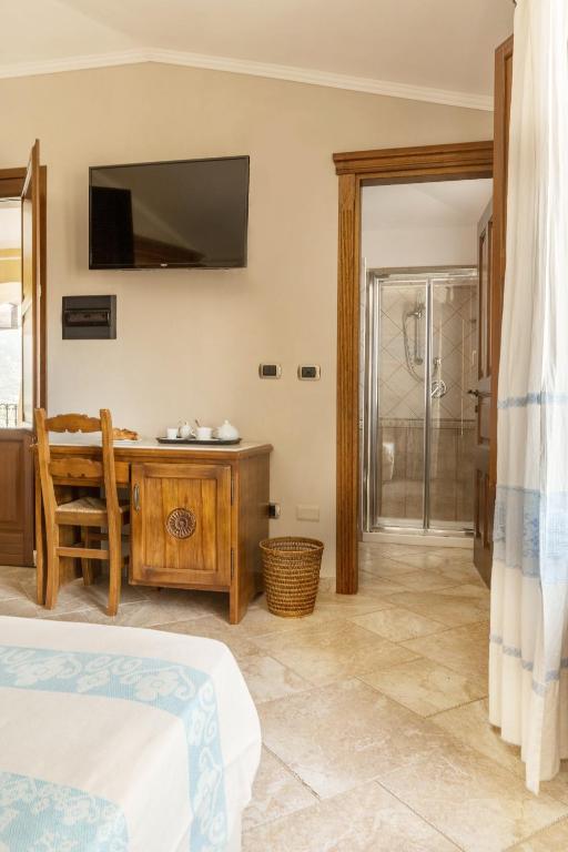 Postel nebo postele na pokoji v ubytování Hotel Sa Suergia
