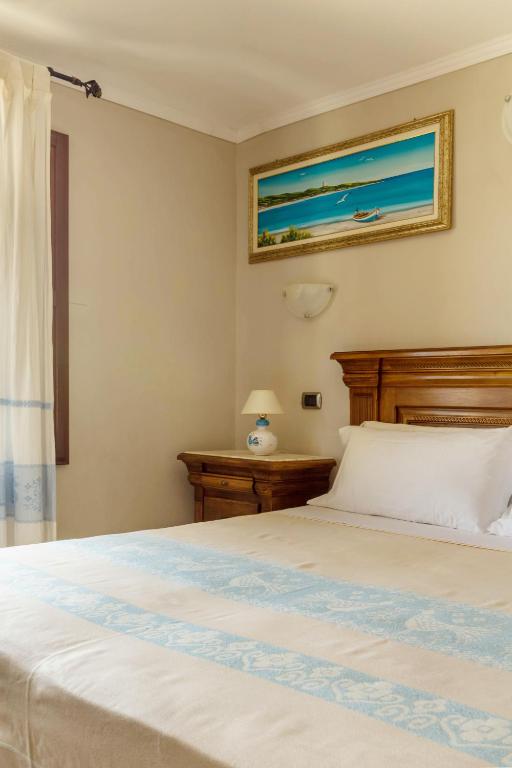 Postel nebo postele na pokoji v ubytování Hotel Sa Suergia