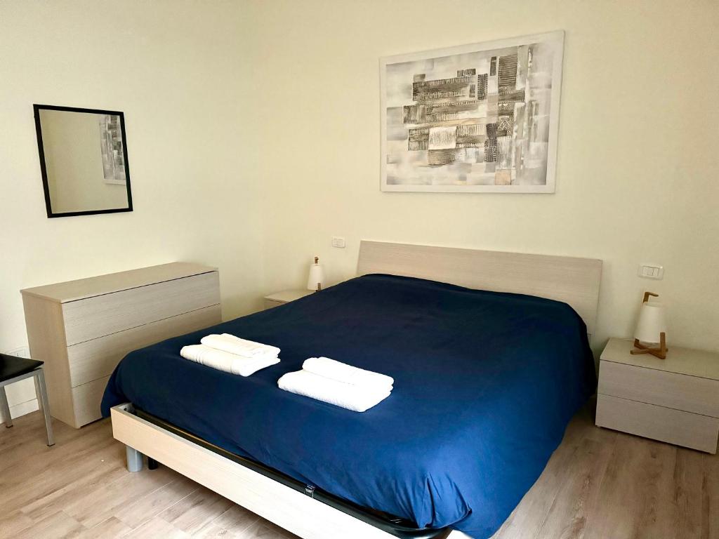 The Cocoon Apartment Giotto tesisinde bir odada yatak veya yataklar