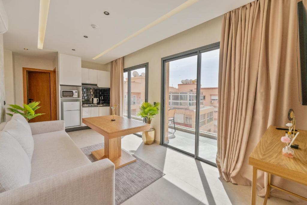 TV a/nebo společenská místnost v ubytování Appart Hôtel Rambla
