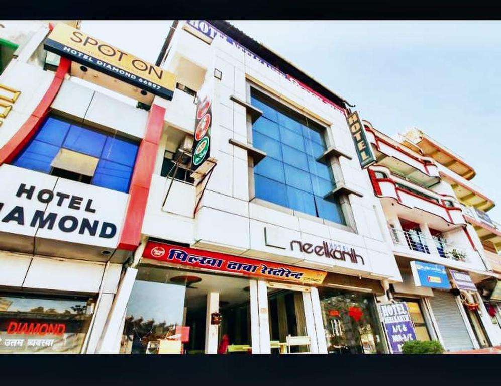 a building with many signs on the side of it at Hotel Neelkanth , Bhopal in Bhopal