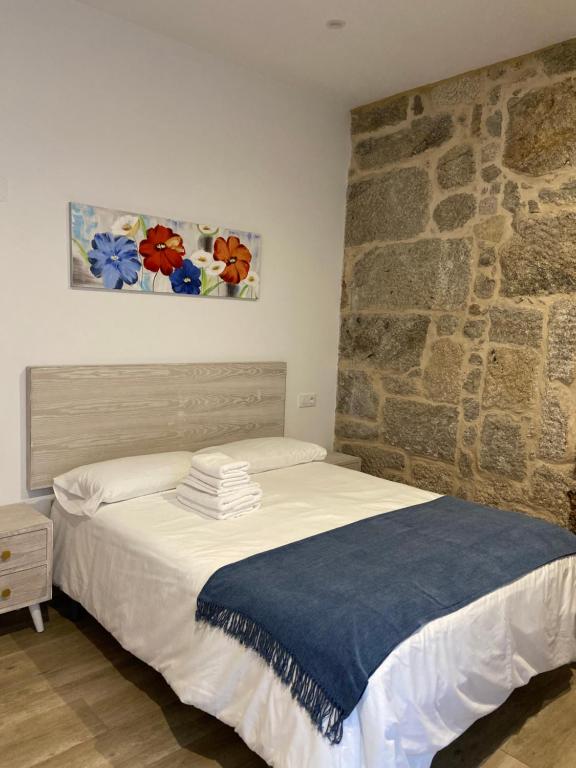 Postel nebo postele na pokoji v ubytování Reginita Apartamentos