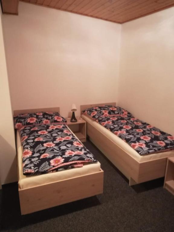 Postel nebo postele na pokoji v ubytování Penzion Hilšer