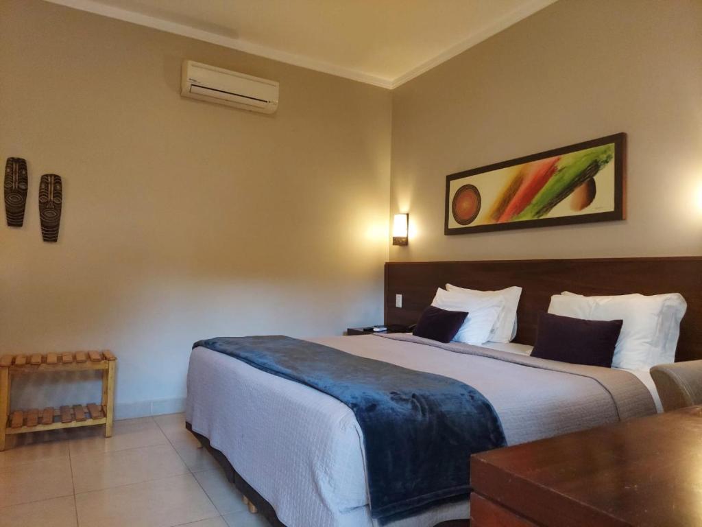 Postel nebo postele na pokoji v ubytování Hotel Pousada Santa Rita