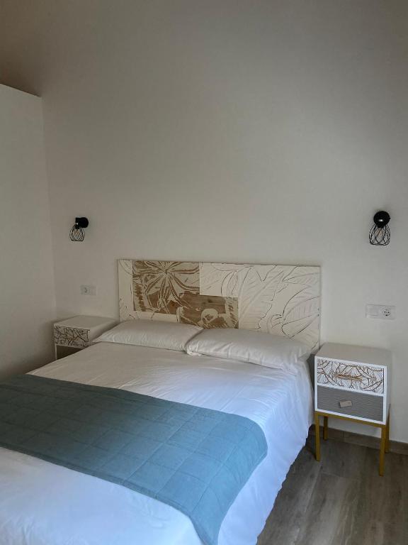 Postel nebo postele na pokoji v ubytování Reginita Apartamentos