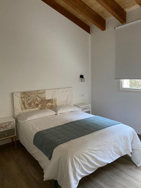 Postel nebo postele na pokoji v ubytování Reginita Apartamentos