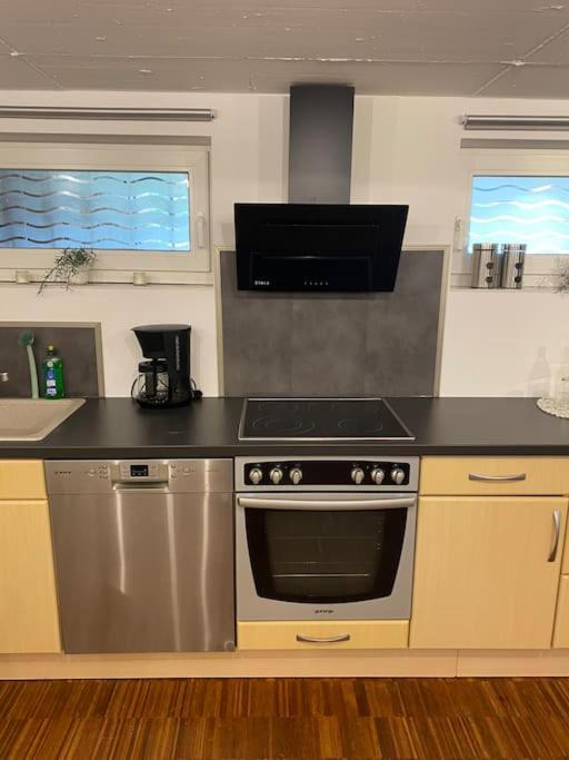 a kitchen with a stainless steel stove top oven at Gästehaus Brunswiek Studio in Vordorf
