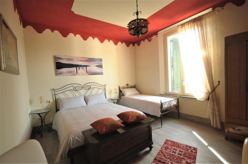 Postel nebo postele na pokoji v ubytování Villa Gemma