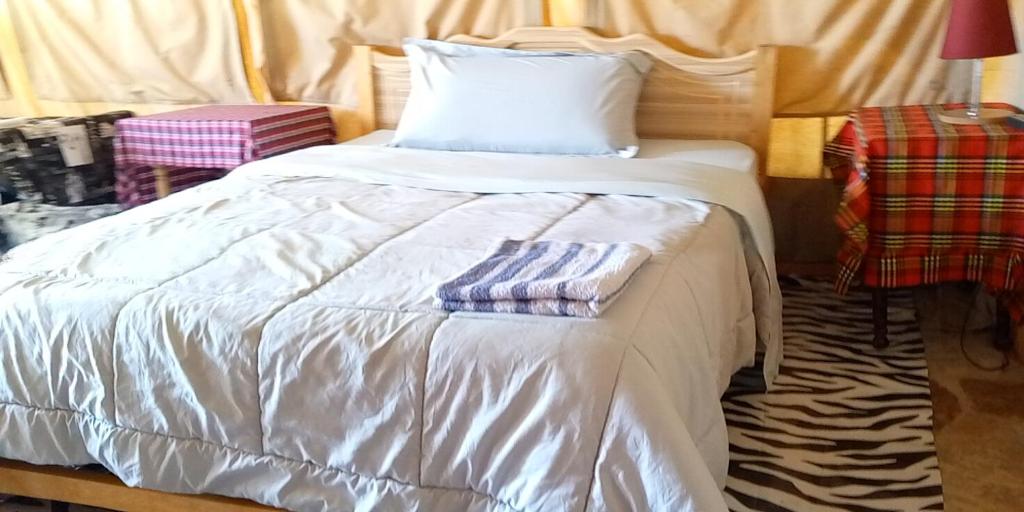 Postel nebo postele na pokoji v ubytování Esam Homestay