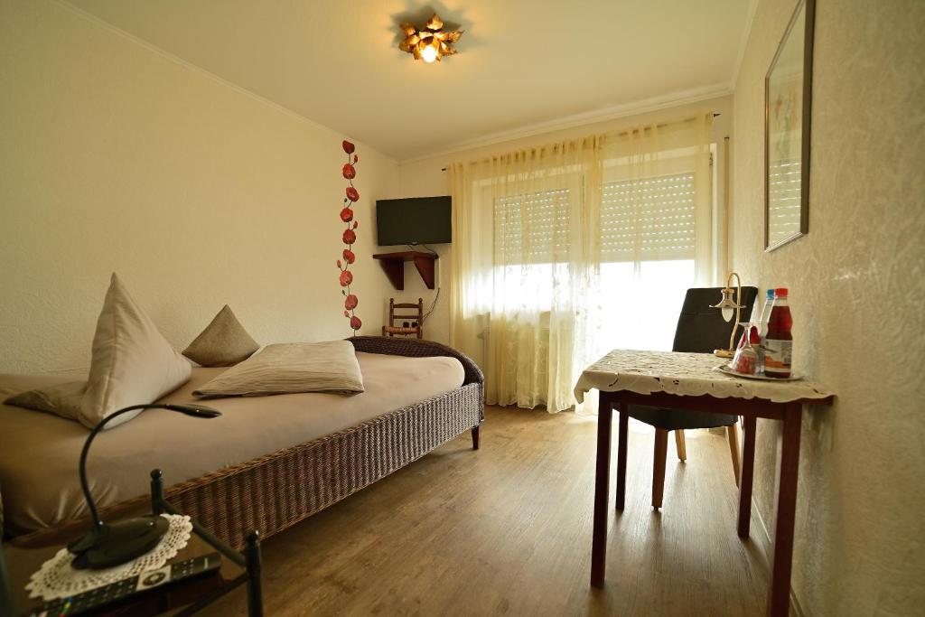 Postel nebo postele na pokoji v ubytování Hotel Zrenners GARNI