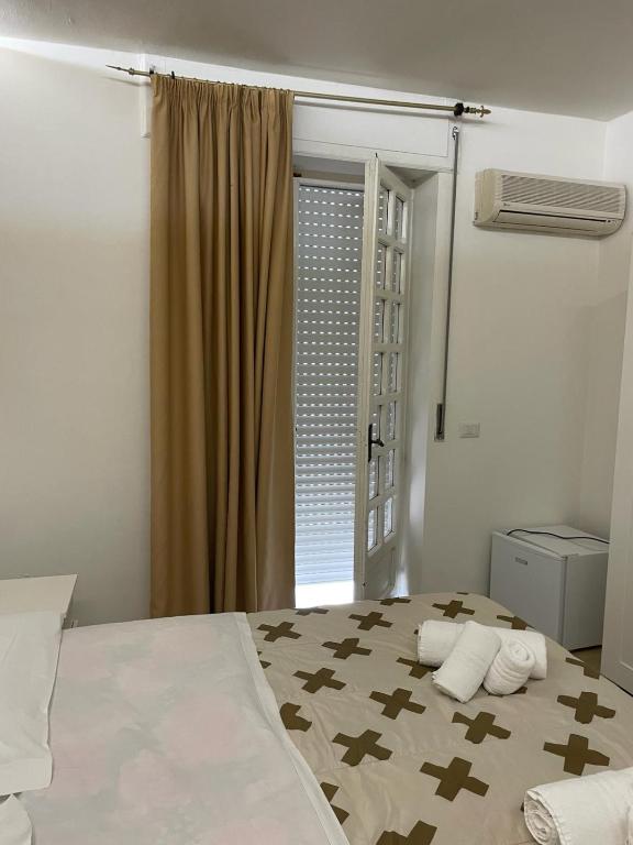 Postel nebo postele na pokoji v ubytování SOLARIS PAESTUM