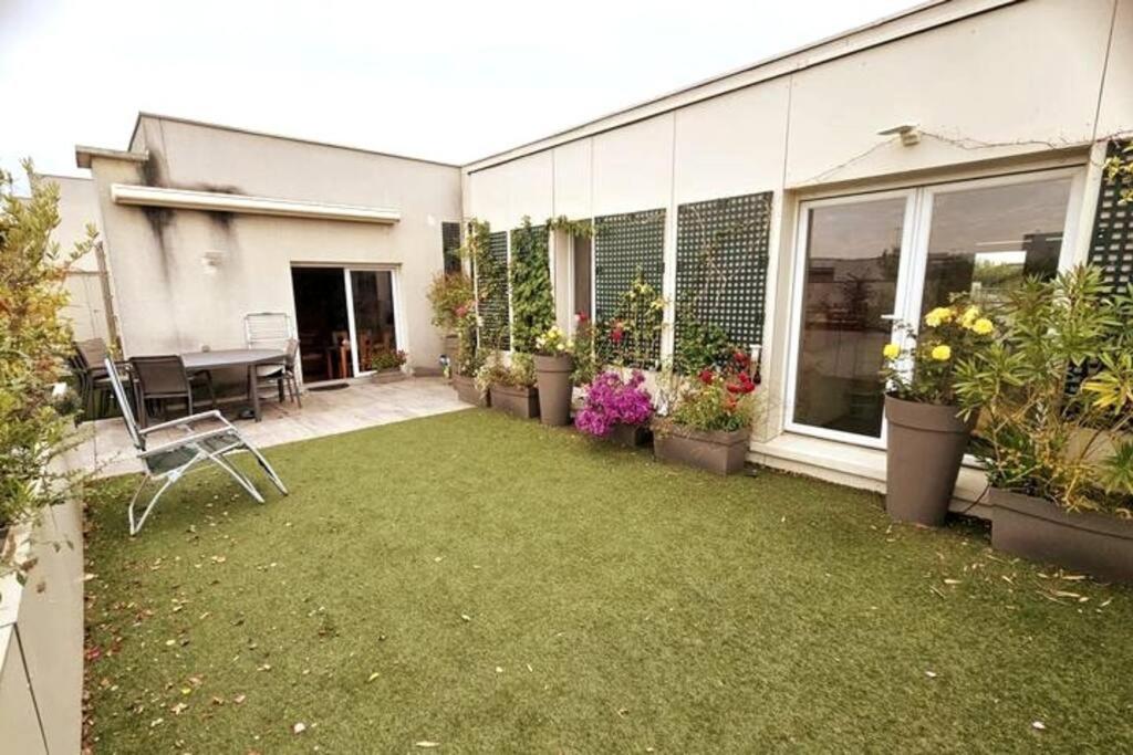 Photo de la galerie de l'établissement Olympia - Penthouse of 120 sqm - 100m from the Stade de France, à Saint-Denis