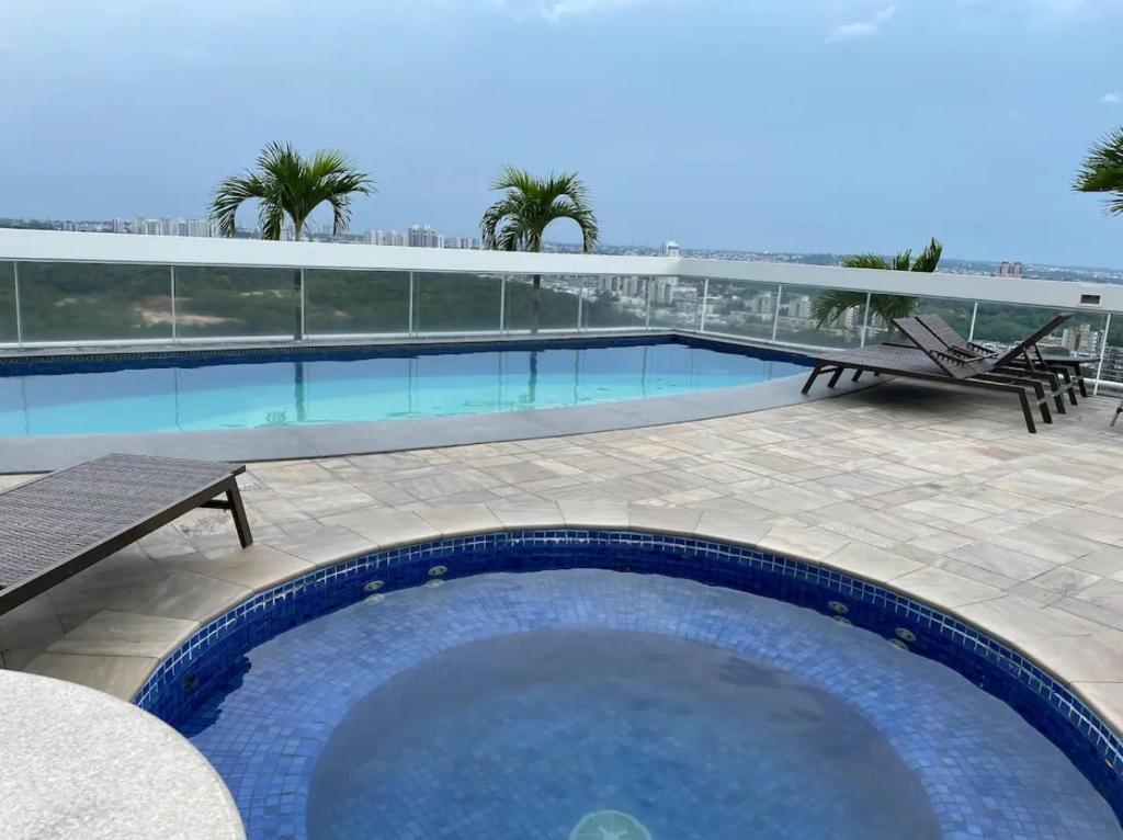 Bazén v ubytování Manaus hotéis millennium flat nebo v jeho okolí