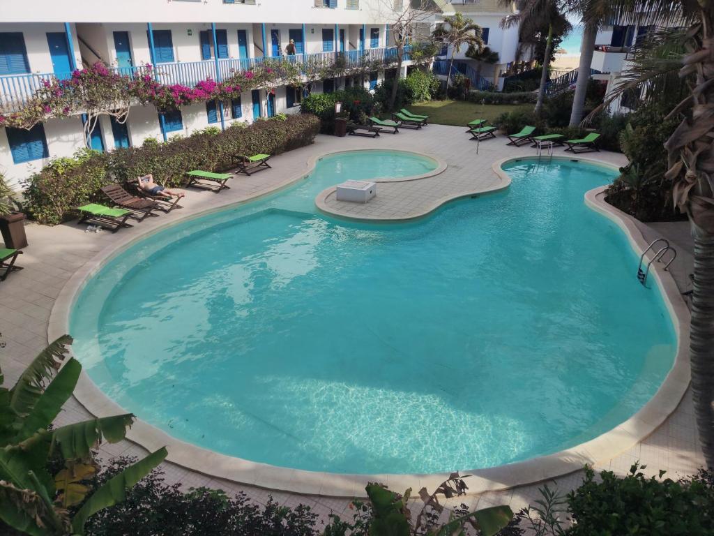 a large pool in the middle of a resort at Residence Amanda with pool in Santa Maria